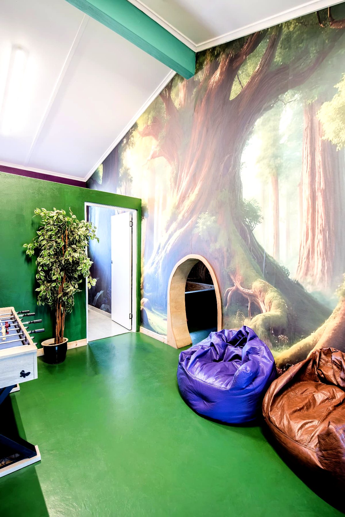 Kids' play room with mural and bean bags